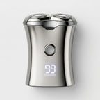 Silver electric shaver with digital display on a white background