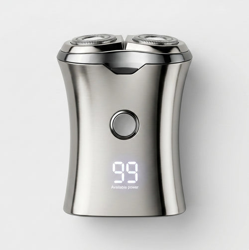 Silver electric shaver with digital display on a white background